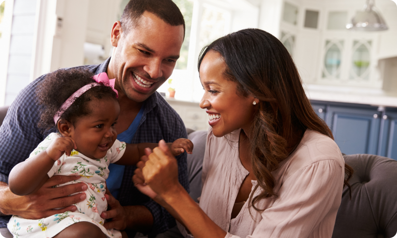 Family holding baby